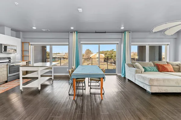 a living room with furniture and a table