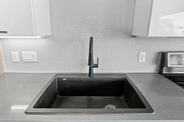 a kitchen with a sink and a window