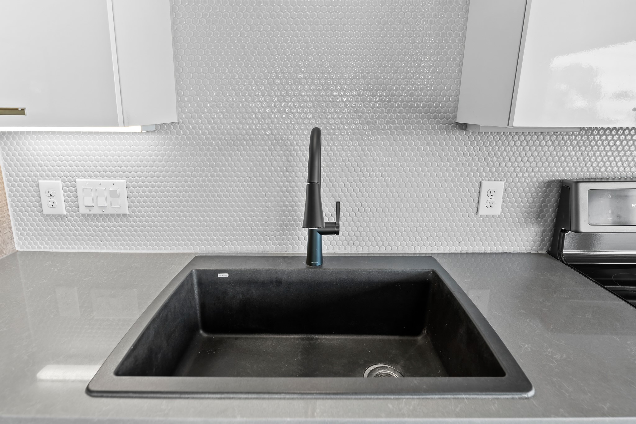 4361 South Congress Avenue, Unit 301 Austin, TX 78745 - Photo 9 of 40 a kitchen with a sink and a window