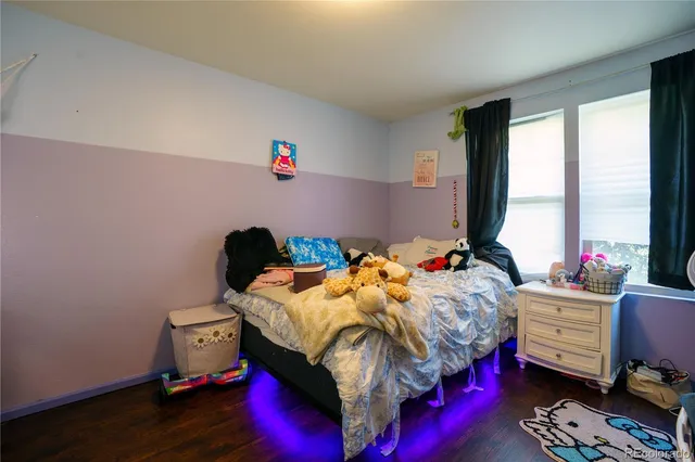 a bedroom with bed and a window