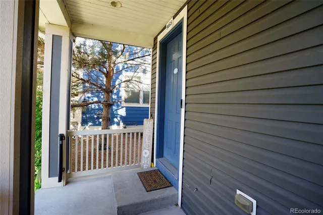 a view of a porch with wooden floor