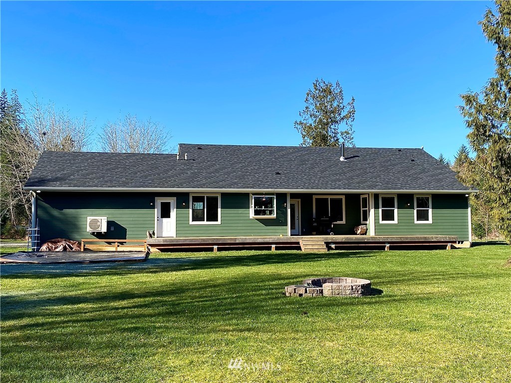 22004 Lee Road Southwest Centralia, WA 98531 - Photo 19 of 26 a front view of a house with a yard table and chairs