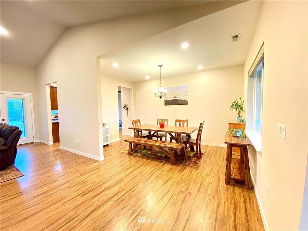 22004 Lee Road Southwest Centralia, WA 98531 - Photo 2 of 26 a living room with furniture and a wooden floor