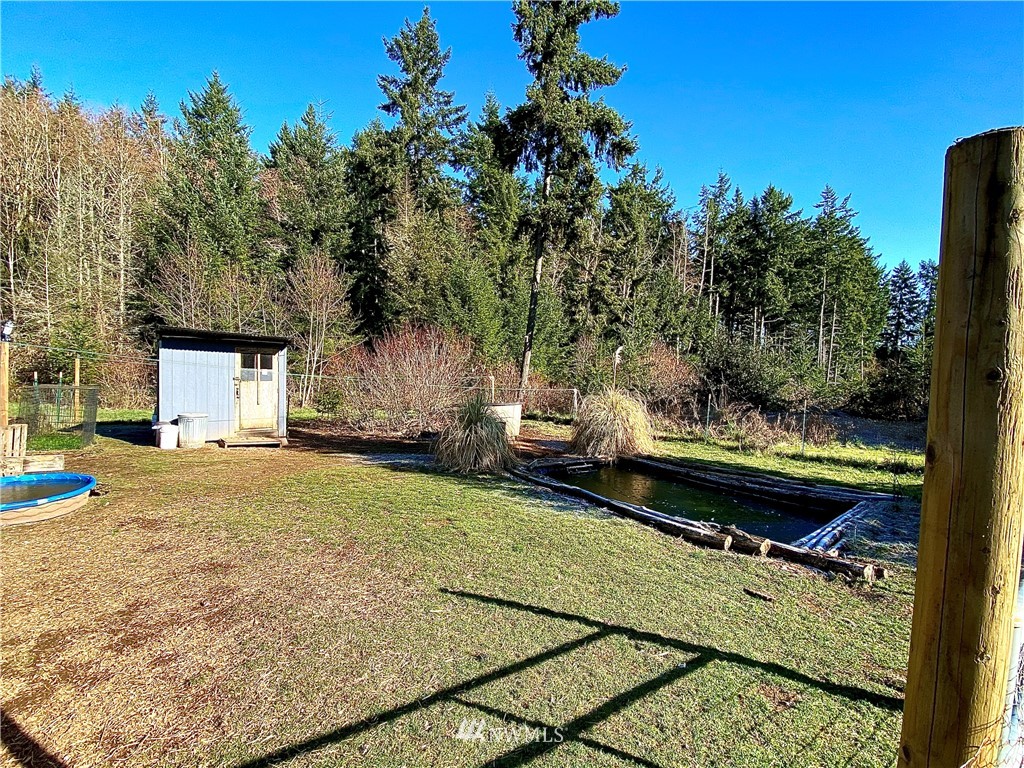 22004 Lee Road Southwest Centralia, WA 98531 - Photo 21 of 26 a view of a backyard with a garden and trees