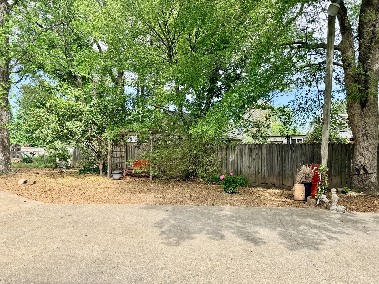 2123 North Avenue Metropolis, IL 62960 - Photo 15 of 49 a view of a backyard with a parked car and slide