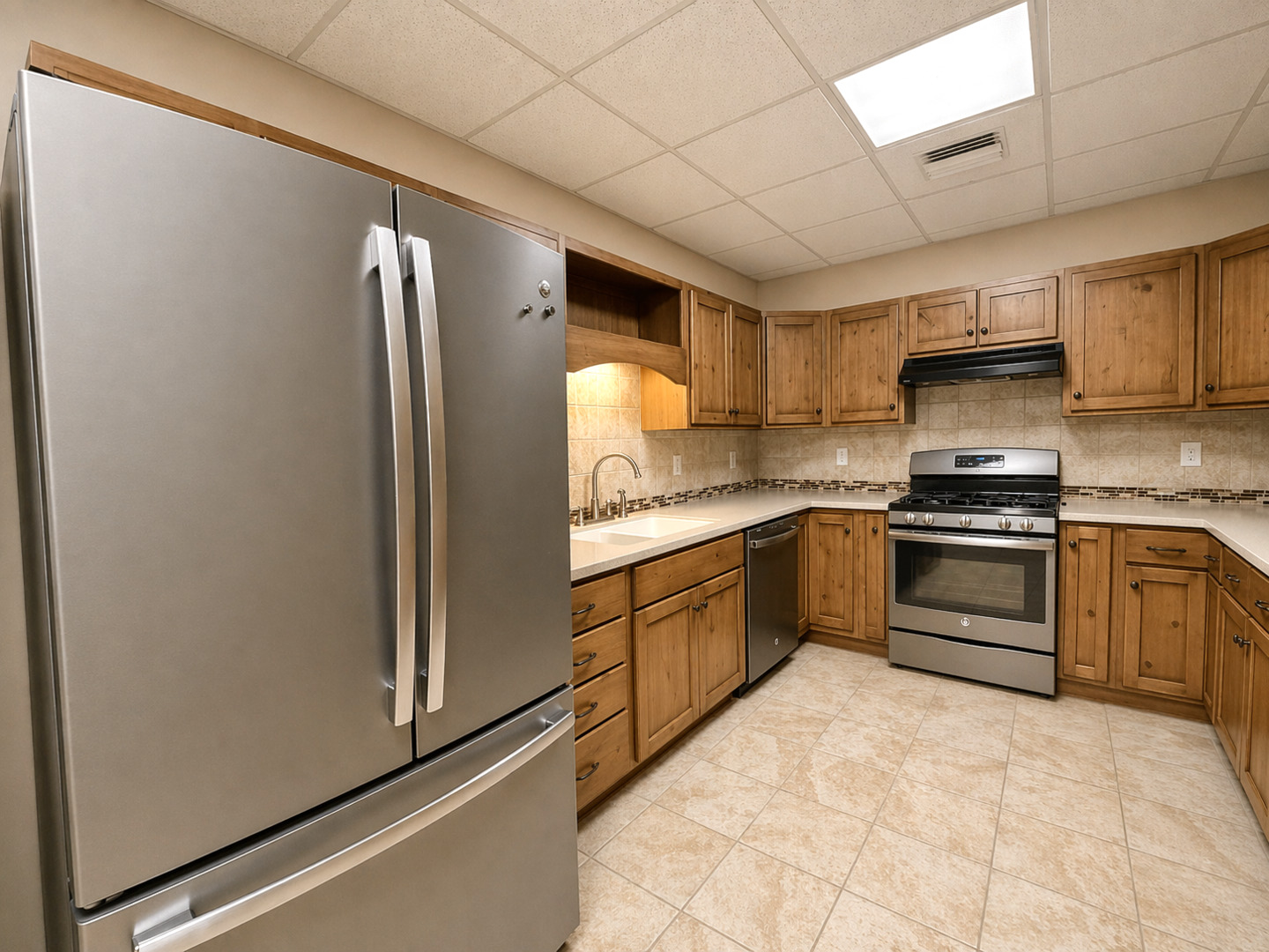 2123 North Avenue Metropolis, IL 62960 - Photo 21 of 49 a kitchen with stainless steel appliances granite countertop a refrigerator and a stove top oven