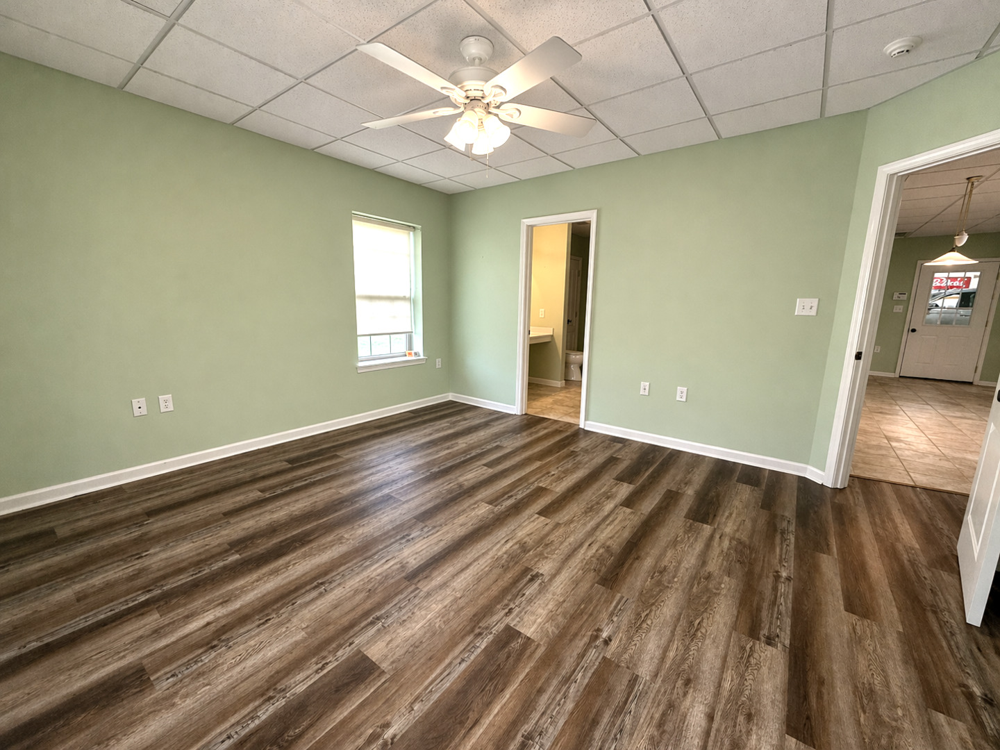 2123 North Avenue Metropolis, IL 62960 - Photo 27 of 49 wooden floor in an empty room with a window