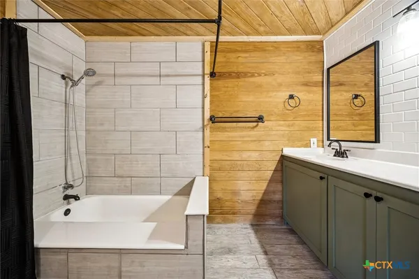 a bathroom with a sink and a bathtub