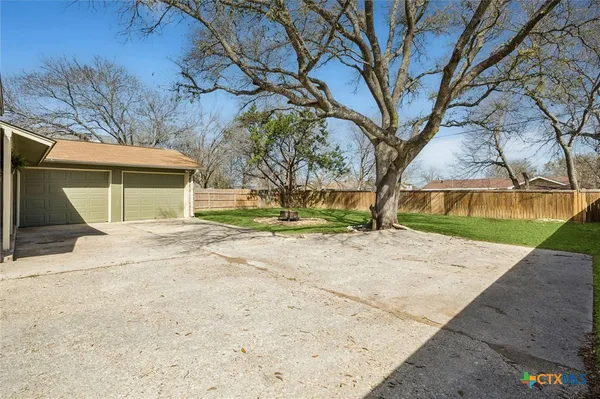 a house with trees in front of it