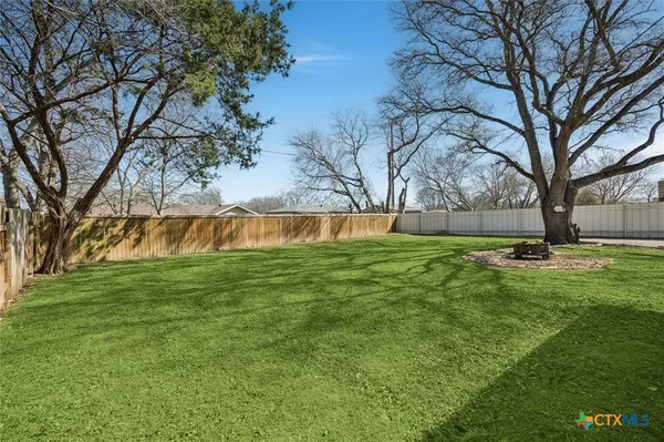 a view of backyard with outdoor space
