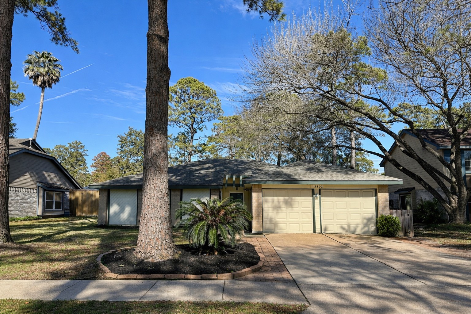 13402 Nevermore Drive Cypress, TX 77429 - Photo 2 of 33 a front view of a house with garden