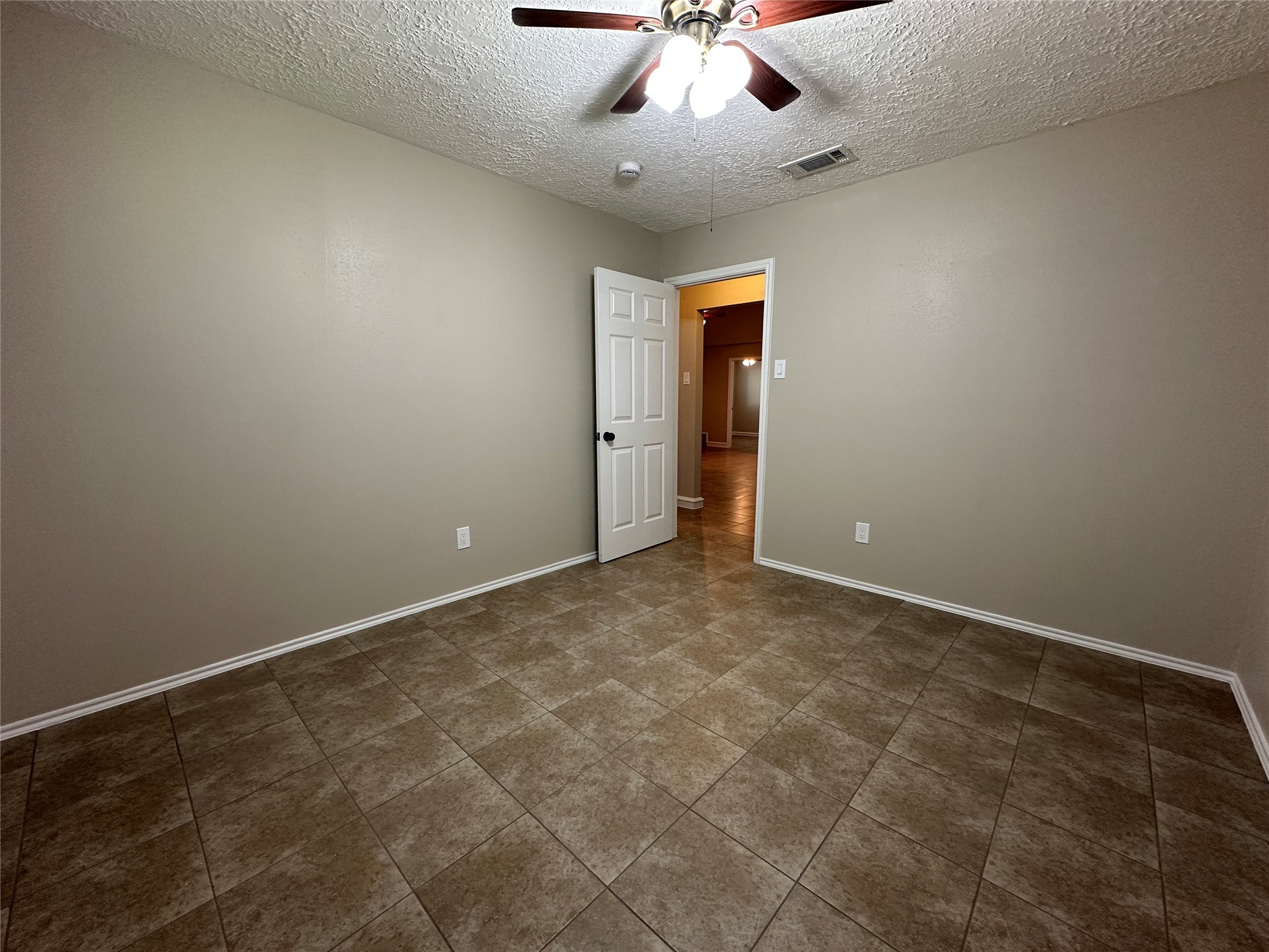 13402 Nevermore Drive Cypress, TX 77429 - Photo 21 of 33 an empty room with a ceiling fan and carpet