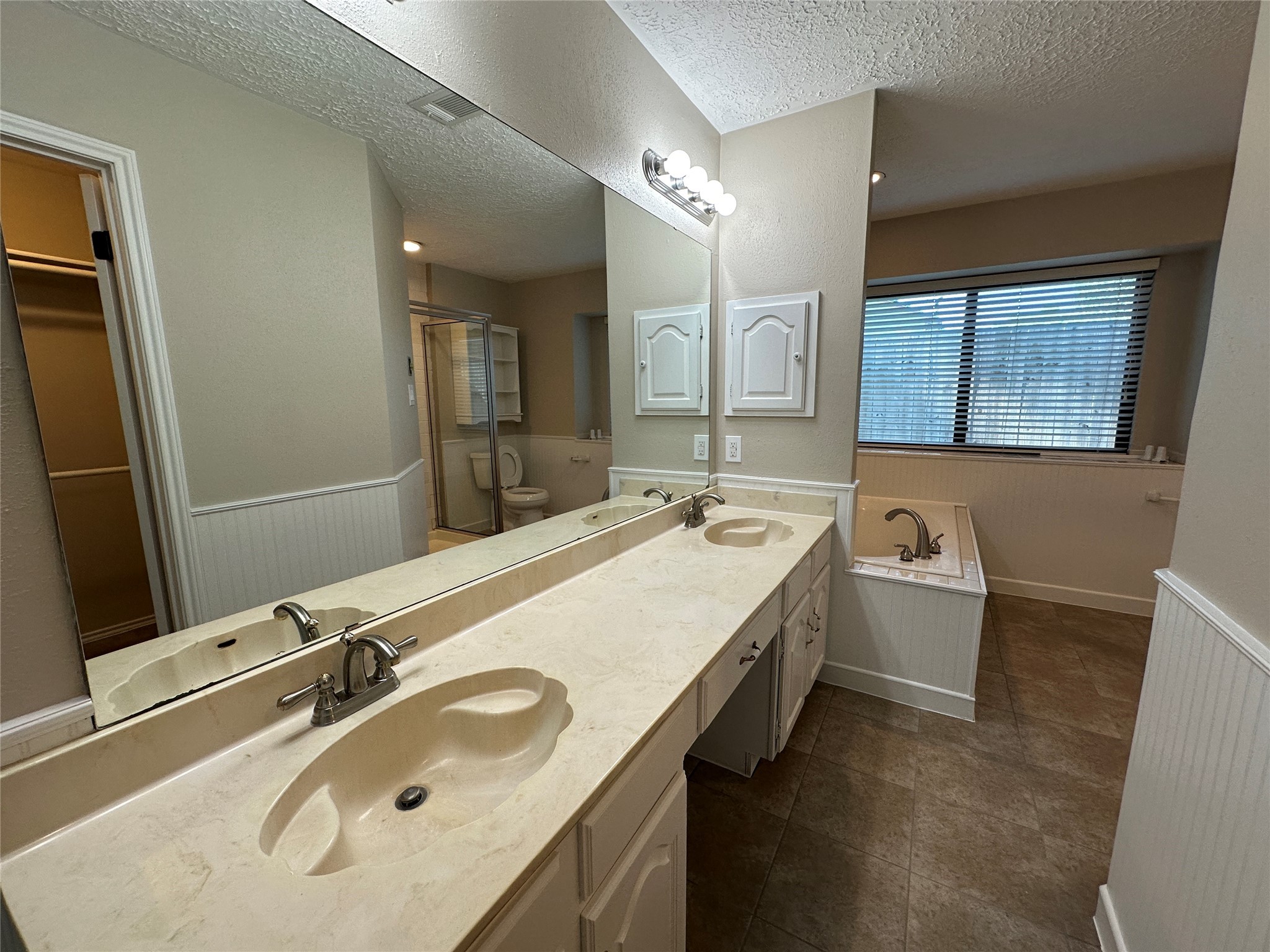 13402 Nevermore Drive Cypress, TX 77429 - Photo 25 of 33 a bathroom with a sink double vanity granite and a mirror