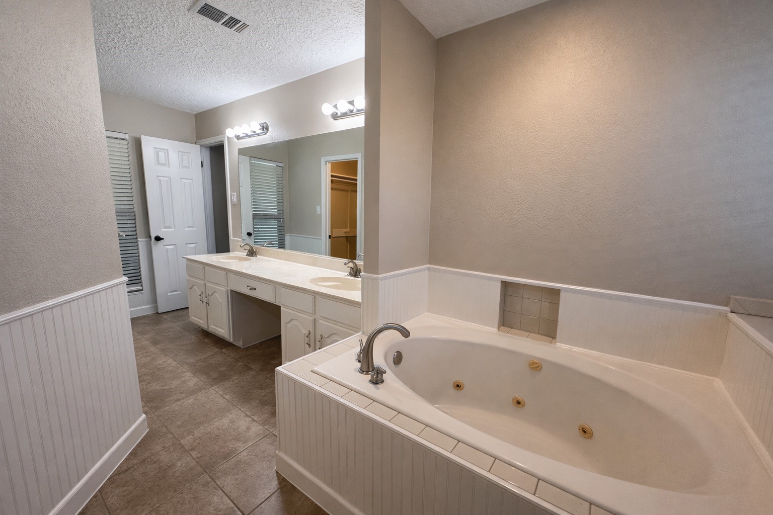 13402 Nevermore Drive Cypress, TX 77429 - Photo 26 of 33 a bathroom with a tub sink and mirror