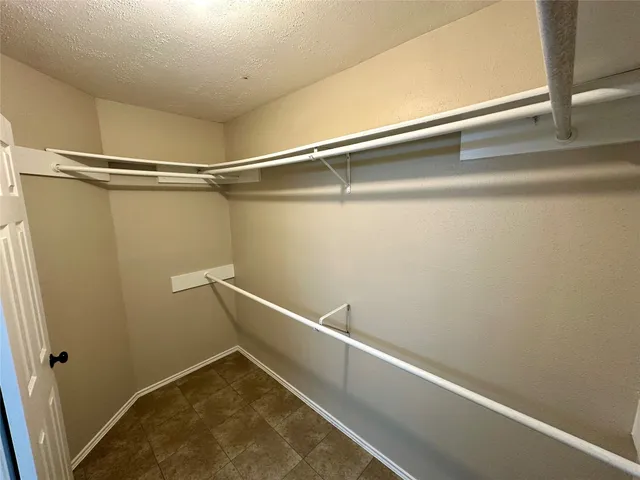 a view of a livingroom with furniture and staircase