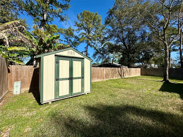 a house that has a tree in front of it