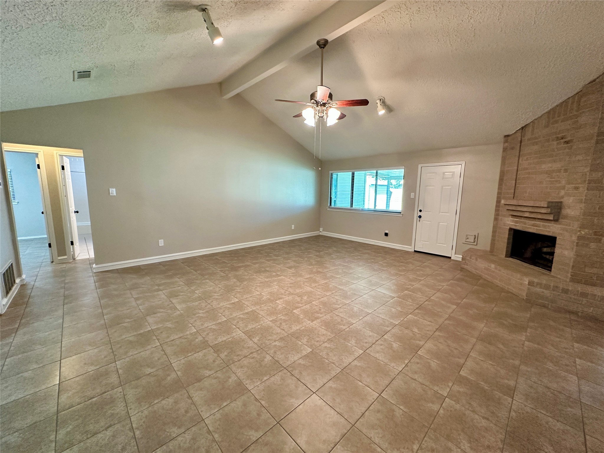 13402 Nevermore Drive Cypress, TX 77429 - Photo 7 of 33 an empty room with windows and fireplace