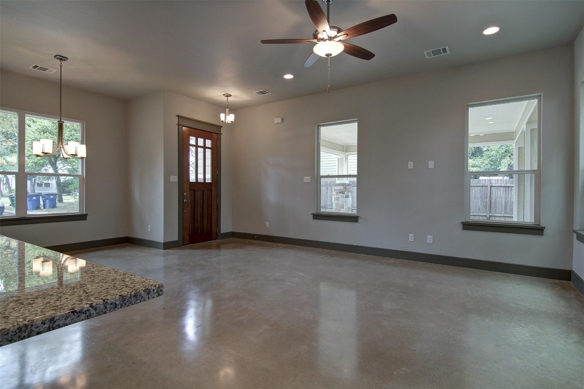 923 East 37th Street Austin, TX 78705 - Photo 9 of 36 a view of a livingroom with a ceiling fan and window