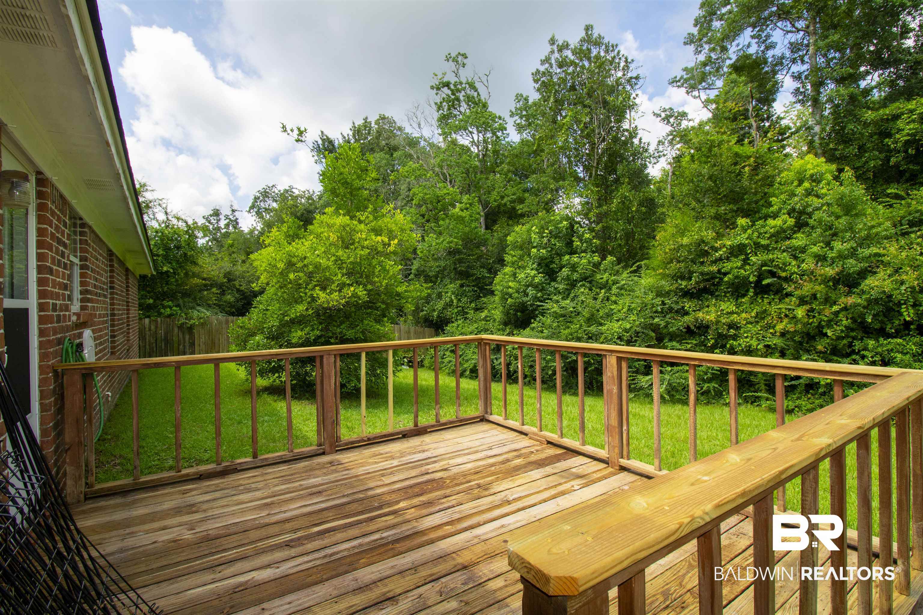 13255 Pointer Drive West Foley, AL 36535 - Photo 3 of 25 Wooden terrace with a yard