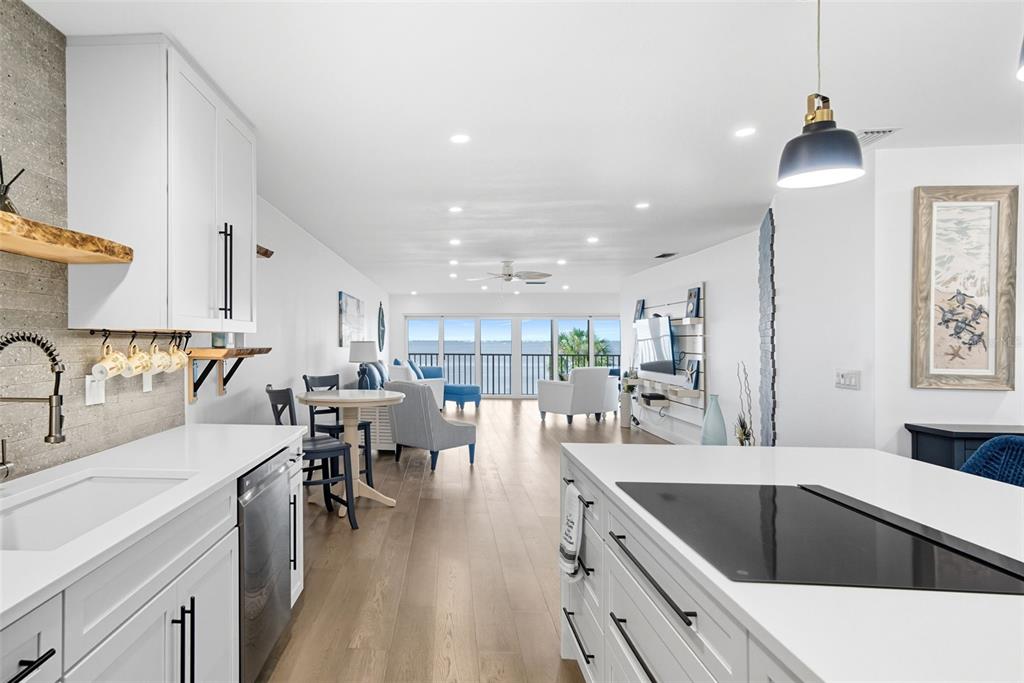 3420 Wild Oak Bay Boulevard, Unit 118 Bradenton, FL 34210 - Photo 16 of 40 a kitchen with stainless steel appliances kitchen island granite countertop a sink and cabinets