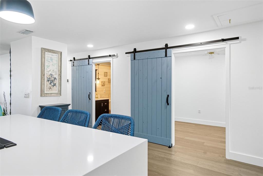 3420 Wild Oak Bay Boulevard, Unit 118 Bradenton, FL 34210 - Photo 17 of 40 a living room with large window and wooden floor