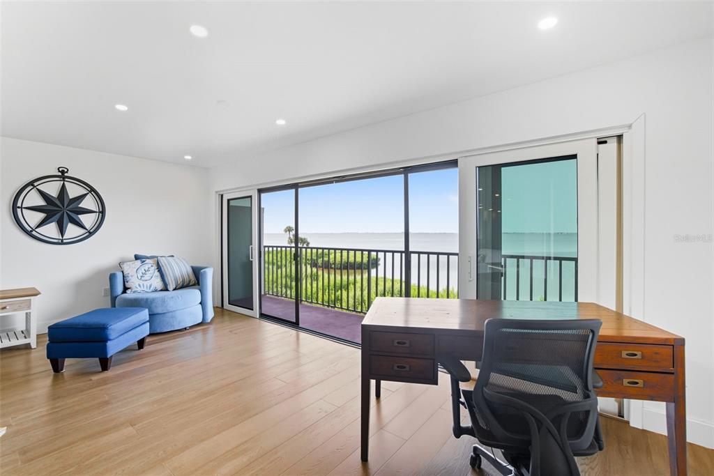 3420 Wild Oak Bay Boulevard, Unit 118 Bradenton, FL 34210 - Photo 19 of 40 a living room with furniture and a window