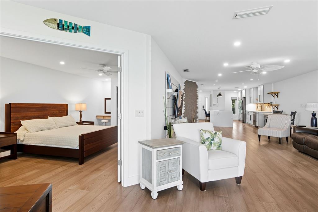 3420 Wild Oak Bay Boulevard, Unit 118 Bradenton, FL 34210 - Photo 22 of 40 a living room with furniture and a wooden floor