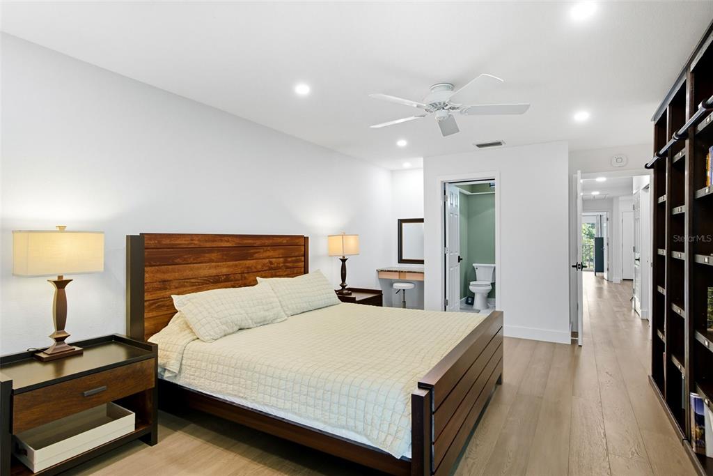 3420 Wild Oak Bay Boulevard, Unit 118 Bradenton, FL 34210 - Photo 23 of 40 a bedroom with a bed and a walk in closet