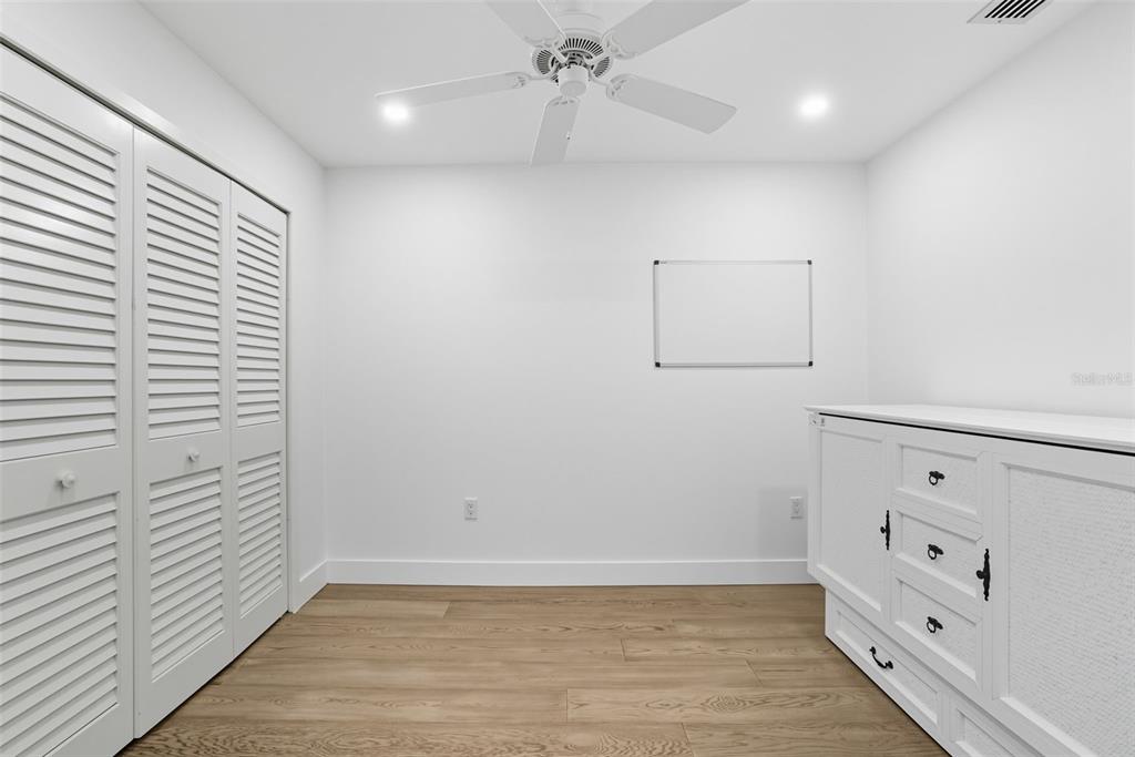 3420 Wild Oak Bay Boulevard, Unit 118 Bradenton, FL 34210 - Photo 28 of 40 wooden floor in an empty room