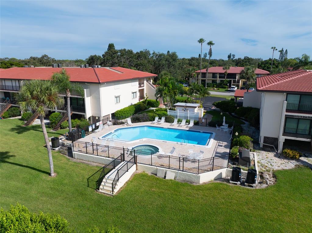 3420 Wild Oak Bay Boulevard, Unit 118 Bradenton, FL 34210 - Photo 37 of 40 an aerial view of a house with swimming pool garden and patio