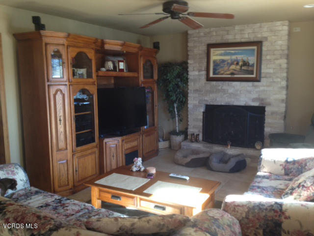 2149 Cutler Street Simi Valley, CA 93065 - Photo 2 of 11 a living room with furniture and a fireplace