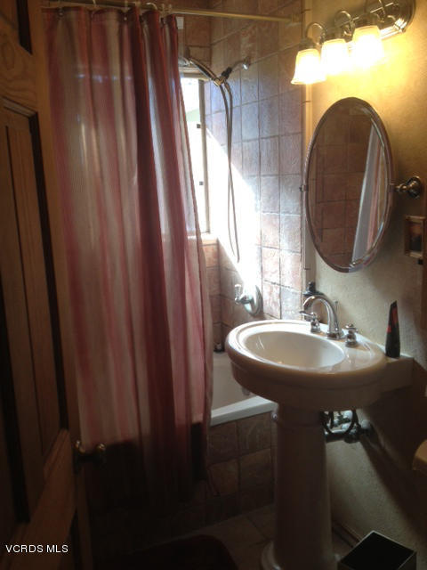 2149 Cutler Street Simi Valley, CA 93065 - Photo 7 of 11 a bathroom with a sink and mirror