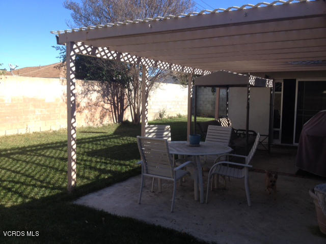 2149 Cutler Street Simi Valley, CA 93065 - Photo 8 of 11 a view of a patio with table and chairs and potted plants