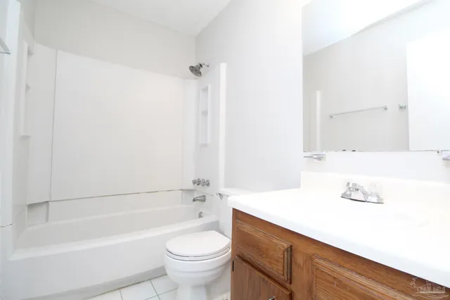a bathroom with a sink a toilet and a bathtub