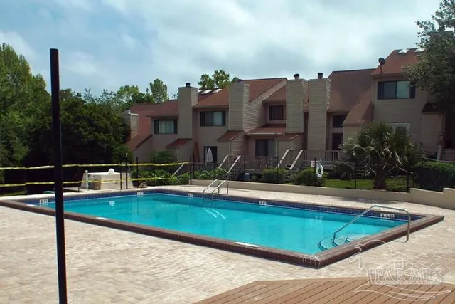a view of a house with swimming pool