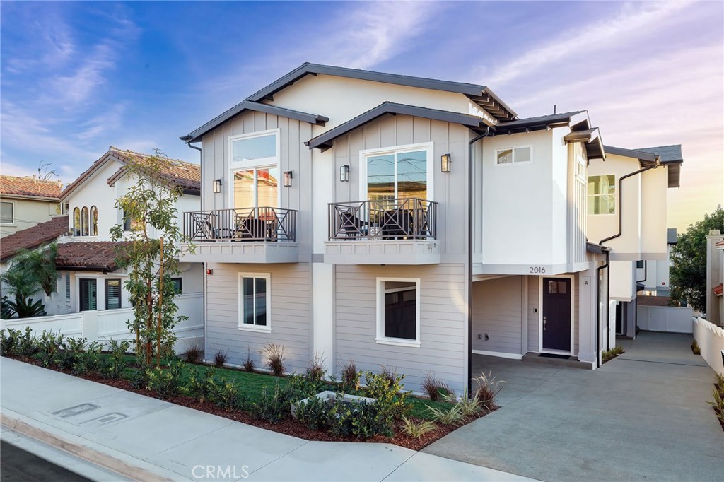 a view of a house with a yard and plants