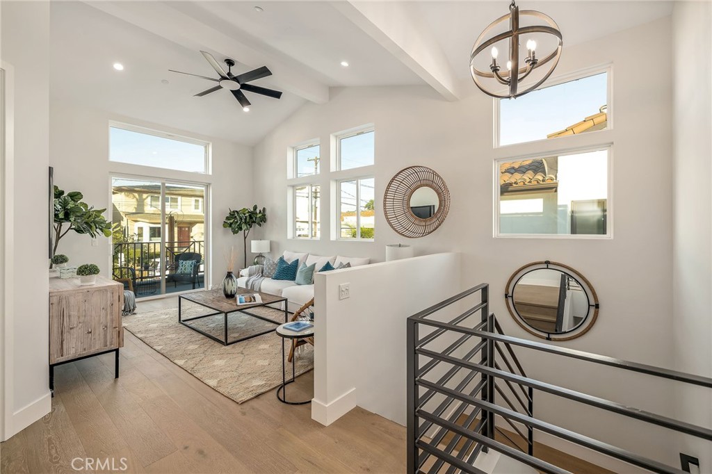 2016 Clark Lane, Unit B Redondo Beach, CA 90278 - Photo 14 of 31 a living room with furniture a window and a clock