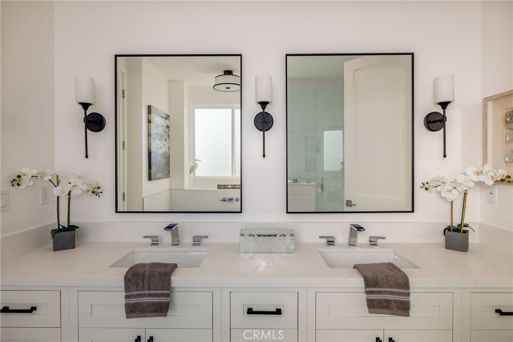 2016 Clark Lane, Unit B Redondo Beach, CA 90278 - Photo 19 of 31 a bathroom with double vanity sinks and a mirror