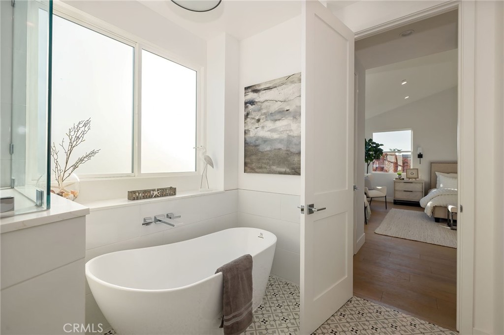 2016 Clark Lane, Unit B Redondo Beach, CA 90278 - Photo 21 of 31 a bathroom with a tub a window and a shower