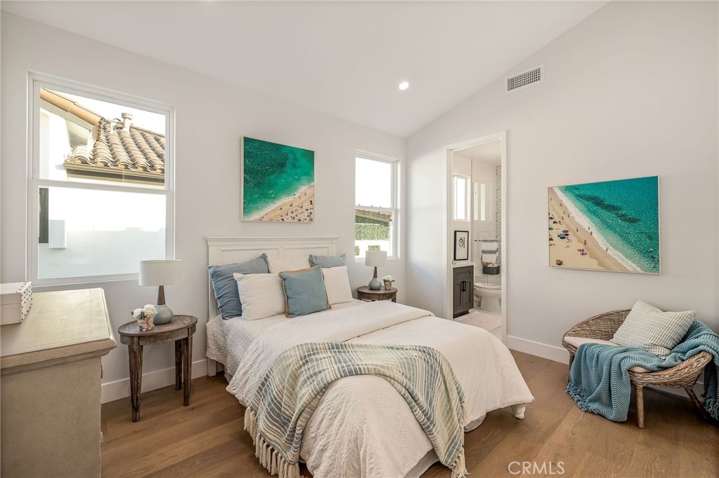 2016 Clark Lane, Unit B Redondo Beach, CA 90278 - Photo 22 of 31 a spacious bedroom with a bed a couch and a window