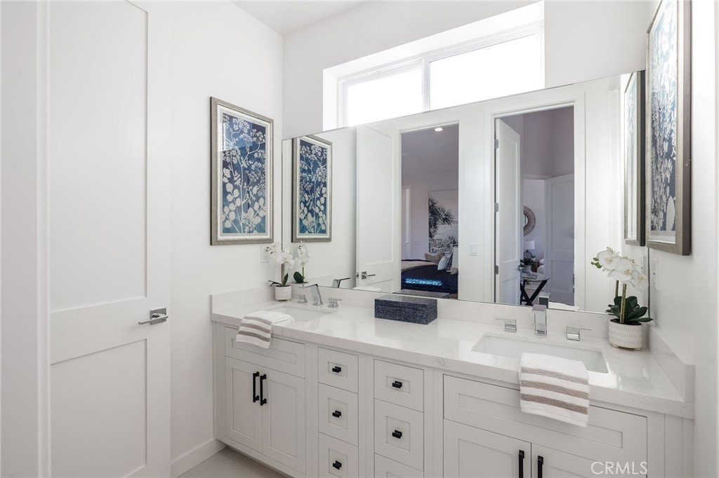 2016 Clark Lane, Unit B Redondo Beach, CA 90278 - Photo 26 of 31 a bathroom with double vanity sink and a mirror