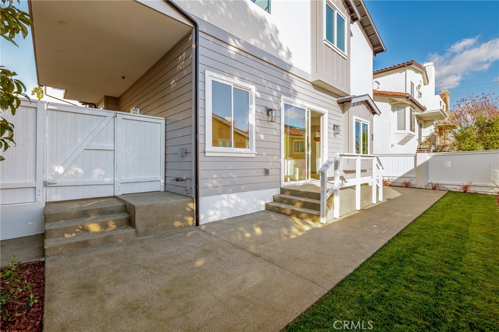 2016 Clark Lane, Unit B Redondo Beach, CA 90278 - Photo 29 of 31 a view of a house with backyard and sitting area