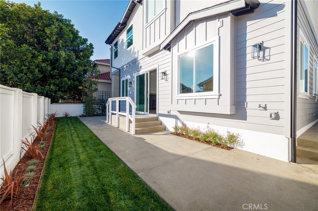 2016 Clark Lane, Unit B Redondo Beach, CA 90278 - Photo 30 of 31 a front view of a house with a yard outdoor seating and garage
