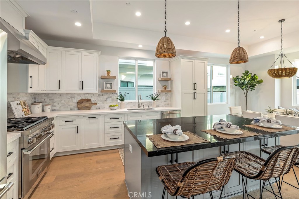 2016 Clark Lane, Unit B Redondo Beach, CA 90278 - Photo 8 of 31 a kitchen with a table chairs stove and microwave