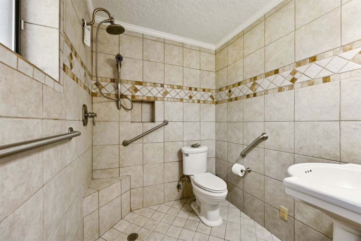 96111 Pirates Bluff Road Yulee, FL 32097 - Photo 25 of 52 a white toilet sitting next to a bathroom sink