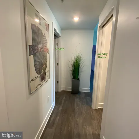 a bathroom with a toilet sink and a mirror