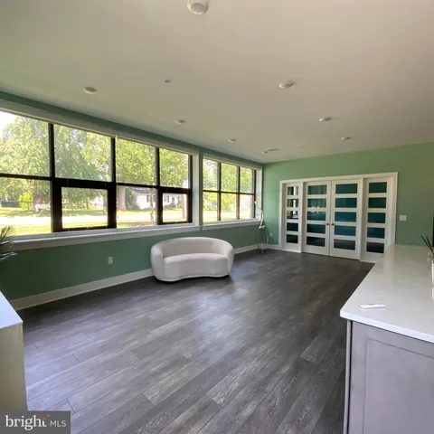a view of an empty room with a fireplace