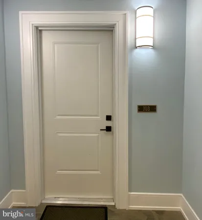 a bathroom with a toilet sink and a mirror