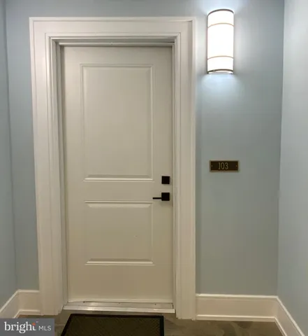 a view of entryway with bathroom