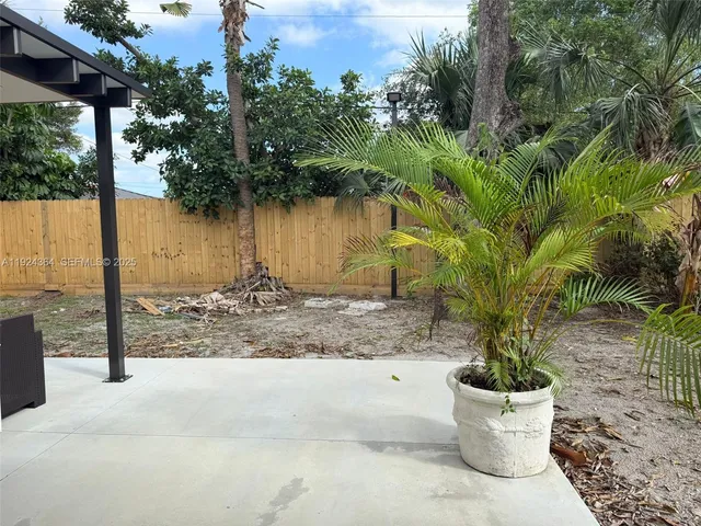 a view of a backyard with plants